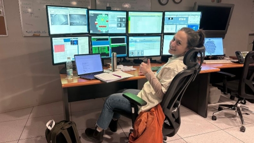Laurella Marin in front of the Blanco 4-M Telescope controls.