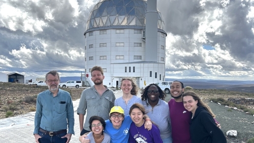 Professor John Thorstensen (left) with students in front of the South African National Observatory