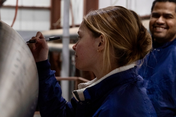 U.C Berkeley engineer Ace Stratton signing the nose cone of 397