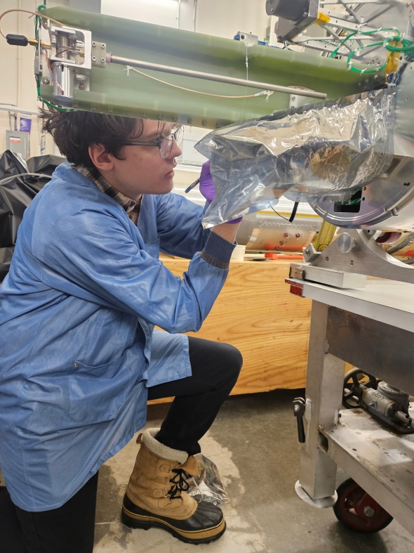 Graduate student Charlie Acomb working on one of the GNEISS rockets at the Poker Flat research range in Alaska. 