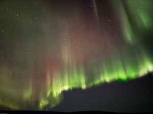 An image of the aurora at the Poker Flat launch site nicely displaying the green and red color bands.