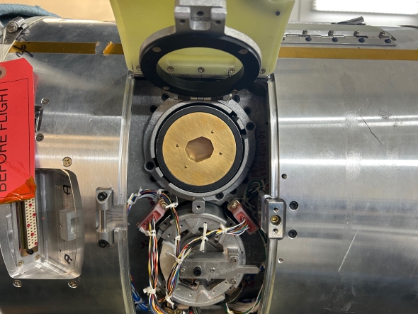 One of the PIP payloads that will be ejected mid flight is secured within the body of a rocket.