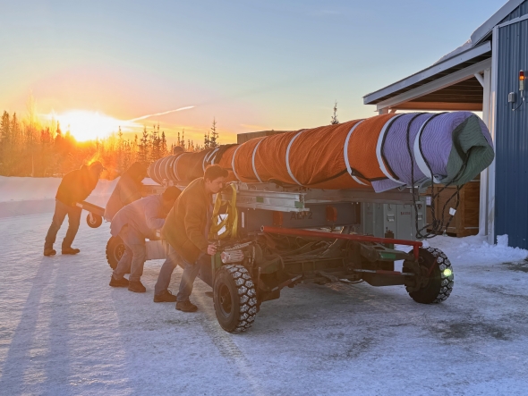 Pushing one of the GNEISS rockets over to the rails.