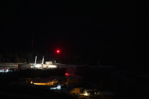 The launchpad is illuminated to spotlight the rails holding the rockets at Poker Flat. 
